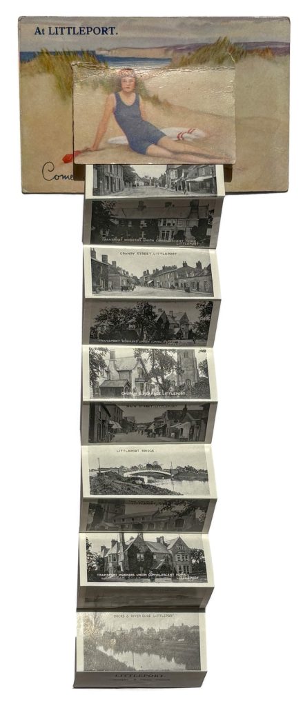 A novelty postcard with the concertina of postcard photographs expanded.